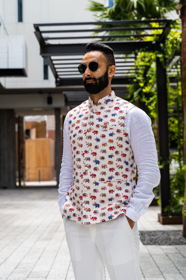 Made by saffron lane, modern indian men's clothing, Indo western men's clothing. Colorful elephant printed nehru vest with an ivory base. Perfect for Indian wedding celebrations, wear to a Mehndi or Sangeet party